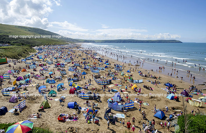 Photo by Guy Harrop. FILE PIC. Woolacombe beach, Devon named best UK beach for a second consecutive year by TripAdvisor users. The 3 mile stretch of golden sand is popular with surfers and beach lovers who pack the destination in the summer months.