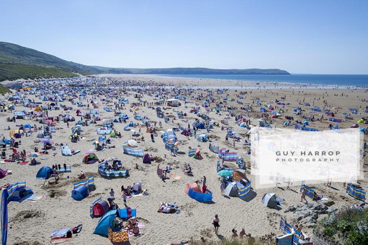 Photo by Guy Harrop. 16/08/16. Thousands of sunbathers enjoy the hot sunshine at Wolacombe beach in Devon where temperatures reached high 20's. image copyright guy harrop info@guyharrop.com 07866 464282