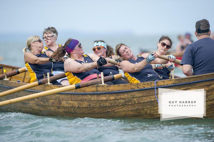 Photo by Guy Harrop. Gig rowers decend on the historical fishing village of Clovelly at the weekend taking part in the 13th gig racing regatta, Devon. The scenic herring fishing village provided a dramatic backdrop as the traditional wooden gigs battled it out in the annual event. image copyright guy harrop info@guyharrop.com 07866 464282