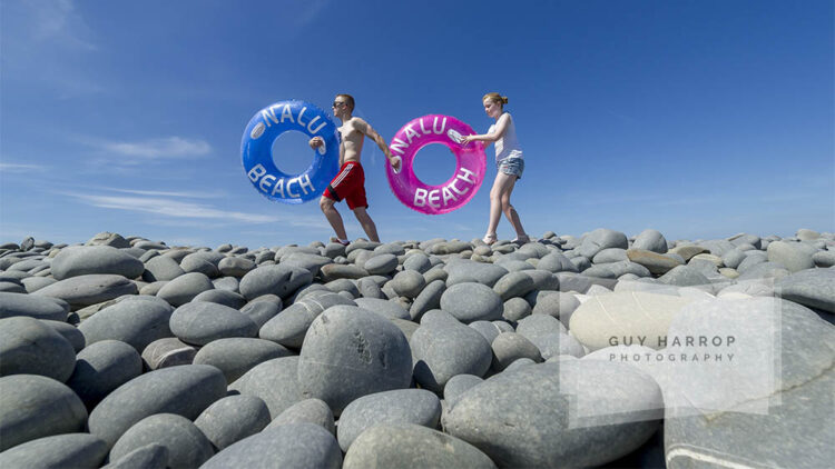 Photo by Guy Harrop. 15/08/16. Holidaymakers Joseph (17) and Sarah(11) McLarnon from West Sussex, enjoy the sunshine on the famous Pebbleridge at Westward Ho! in Devon, where temperatures reached into the late 20's. Britain is basking in sunshine this week as a heatwave sweeps across the UK. image copyright guy harrop info@guyharrop.com 07866 464282