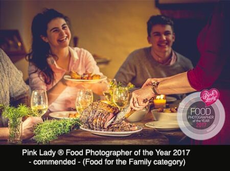 A family enjoying the fun of a traditional roast beef dinner, South West, UK