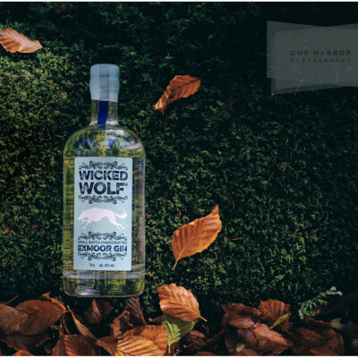 bottle of Wicked Wolf gin surrounded by autumnal leaves © Guy Harrop 2023